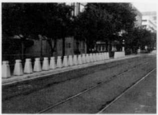 Figure 74. San Diego, California Curbside Pedestrian Barriers. This is an image of rows of barricades along a track.