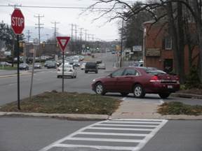 Photo of a median refuge part of crosswalk.