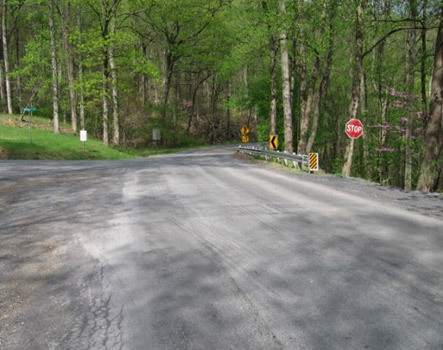 Photo of a barrier at an intersection to prevent vehicles from roadside hazards.